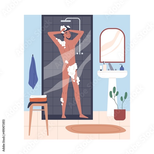 Person taking shower in home bathroom. Happy young man washing naked body in ...