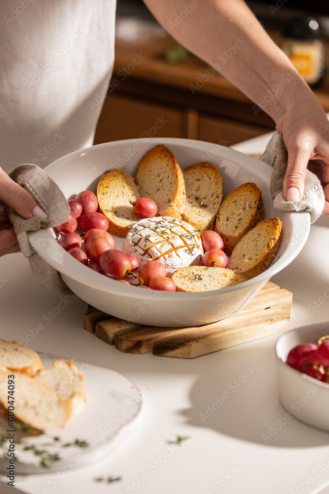 Baked brie cheese with bread and grapes Baked brie cheese with bread and grapes