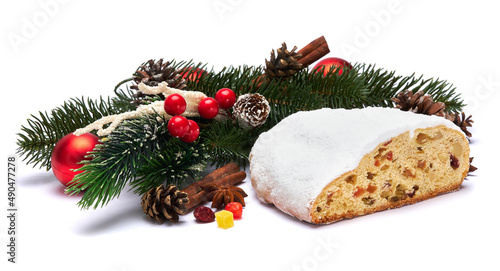 Traditional Christmas stollen cake with marzipan and dried fruit isolated on white background