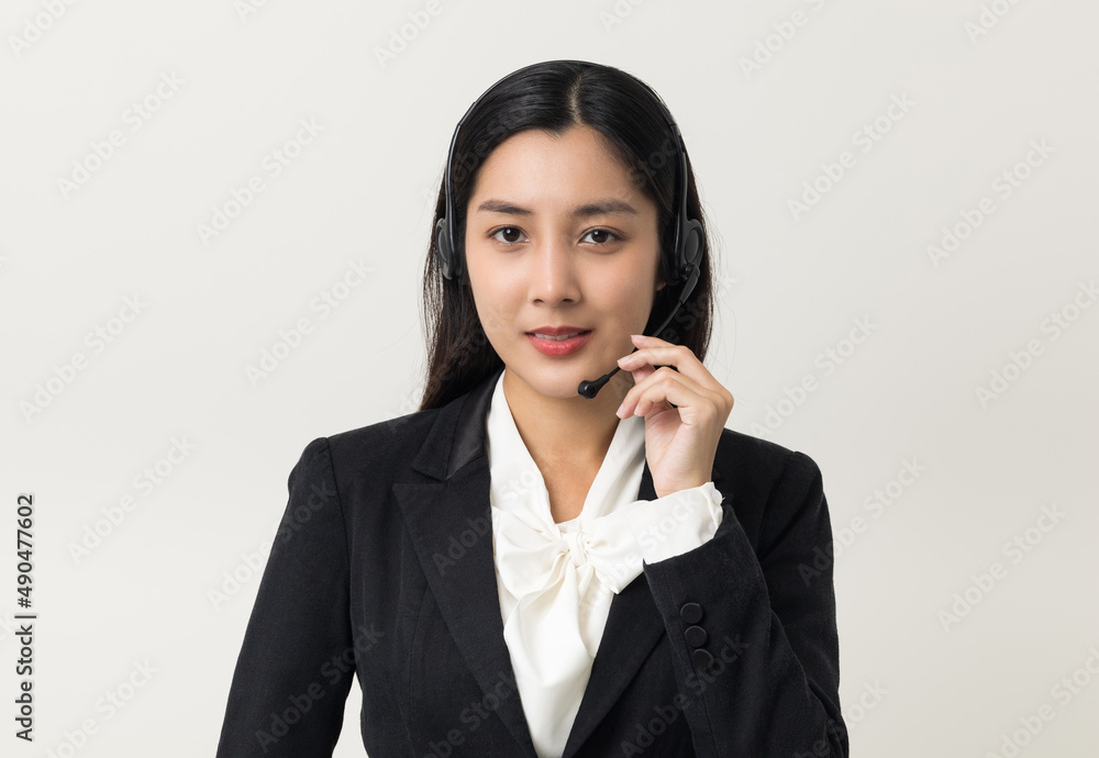 Happy young asian business woman call centre. Welcome female operator put on smalltalk headphone standing on isolated white background. Happy young asian business woman call centre. Welcome female operator put on smalltalk headphone standing on isolated white background.