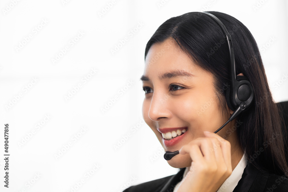 Call centre female operator. Smiling asian business woman receptionist wearing headphone video conference calling talk by webcam in online chat customer support service. Call centre female operator. Smiling asian business woman receptionist wearing headphone video conference calling talk by webcam in online chat customer support service.