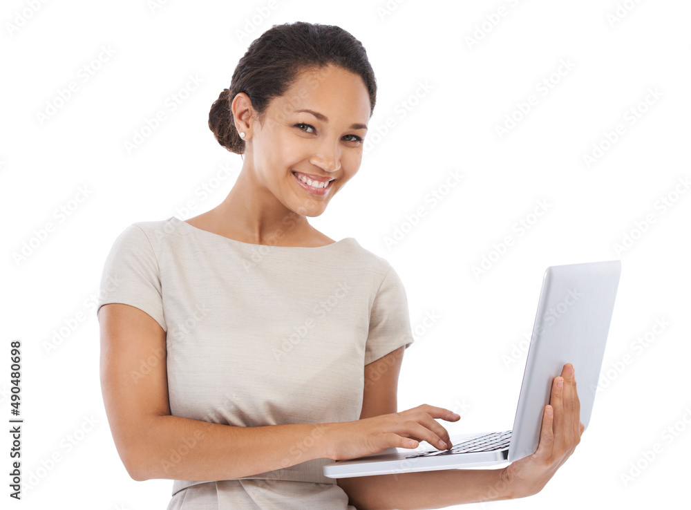Im never far from my laptop. Studio portrait of a young businesswoman using a laptop isolated on white. Im never far from my laptop. Studio portrait of a young businesswoman using a laptop isolated on white.