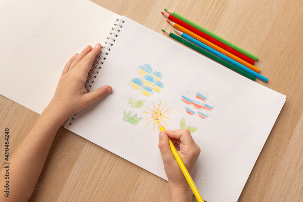 A child's drawing with a call to stop the war. Drawing in the colors of the flags of Russia and Ukraine. There is no war appeal. Stop war