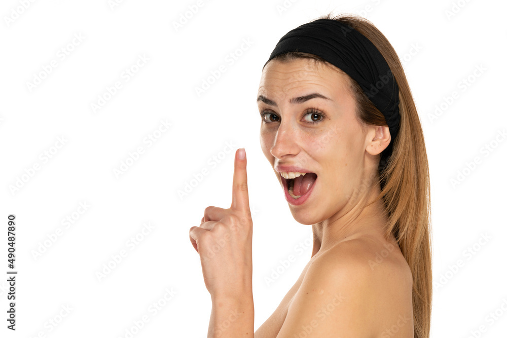 Young beautiful woman having good idea with her finger pointing up isolated on white Young beautiful woman having good idea with her finger pointing up isolated on white
