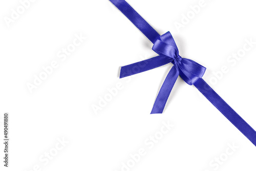 Shiny purple silk ribbon on white background.