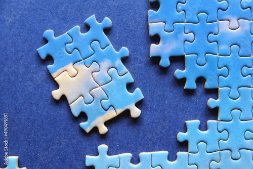 Pieces of Jigsaw puzzle, sky and clouds with blue background