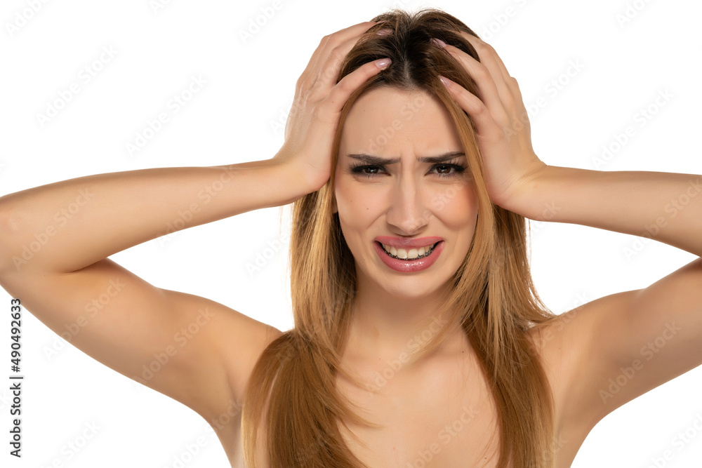 unhappy nervous woman holding her head with her hands unhappy nervous woman holding her head with her hands
