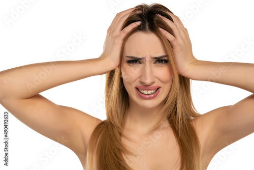 unhappy nervous woman holding her head with her hands