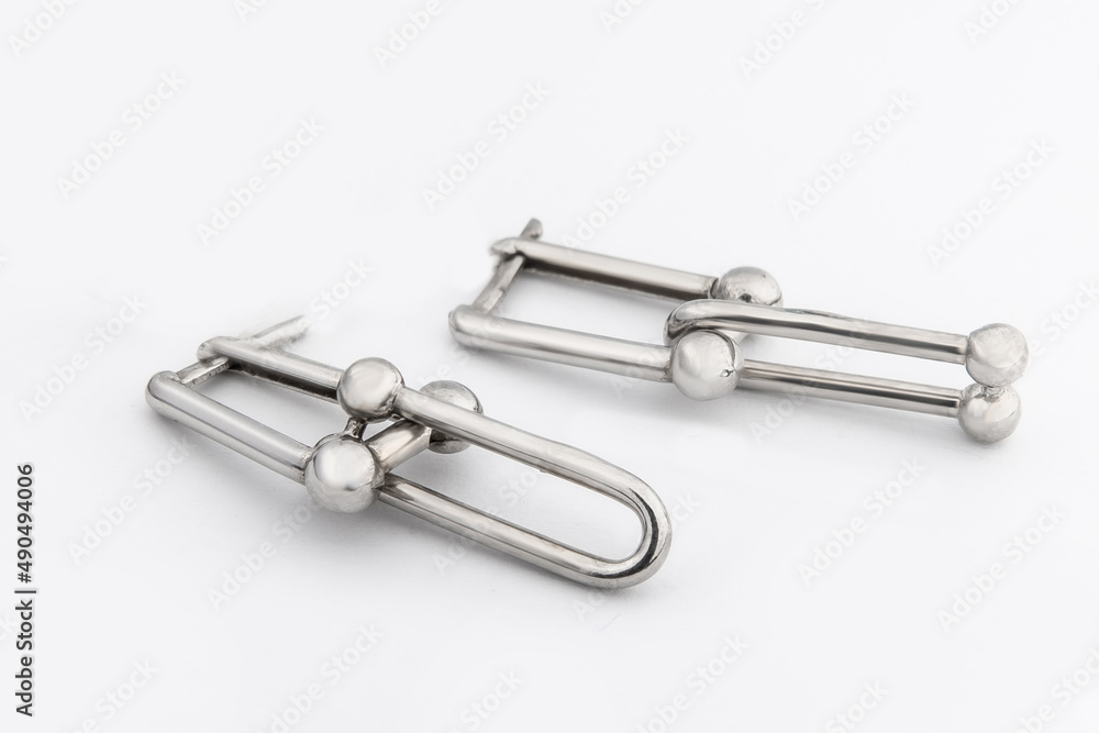 Luxury silver round earrings big jewelry for women isolated on white background, clipping path included Luxury silver round earrings big jewelry for women isolated on white background, clipping path included