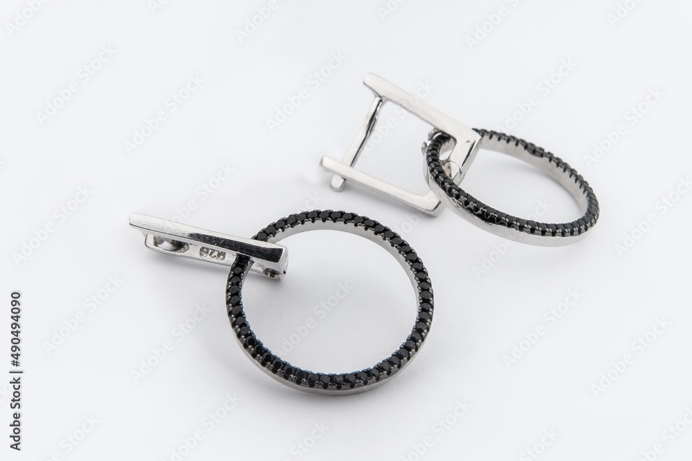 Luxury silver round earrings big jewelry for women isolated on white background, clipping path included Luxury silver round earrings big jewelry for women isolated on white background, clipping path included