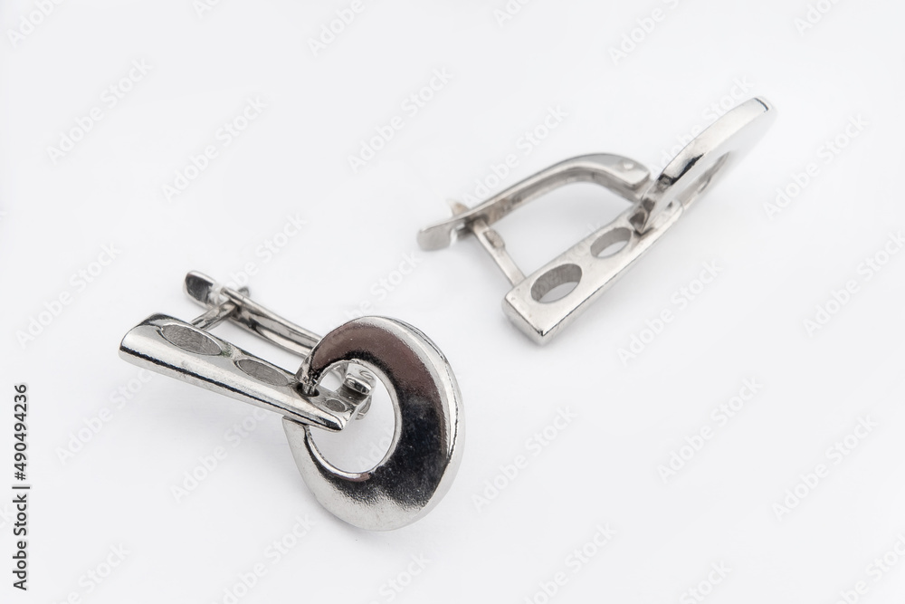 Luxury silver round earrings big jewelry for women isolated on white background, clipping path included Luxury silver round earrings big jewelry for women isolated on white background, clipping path included