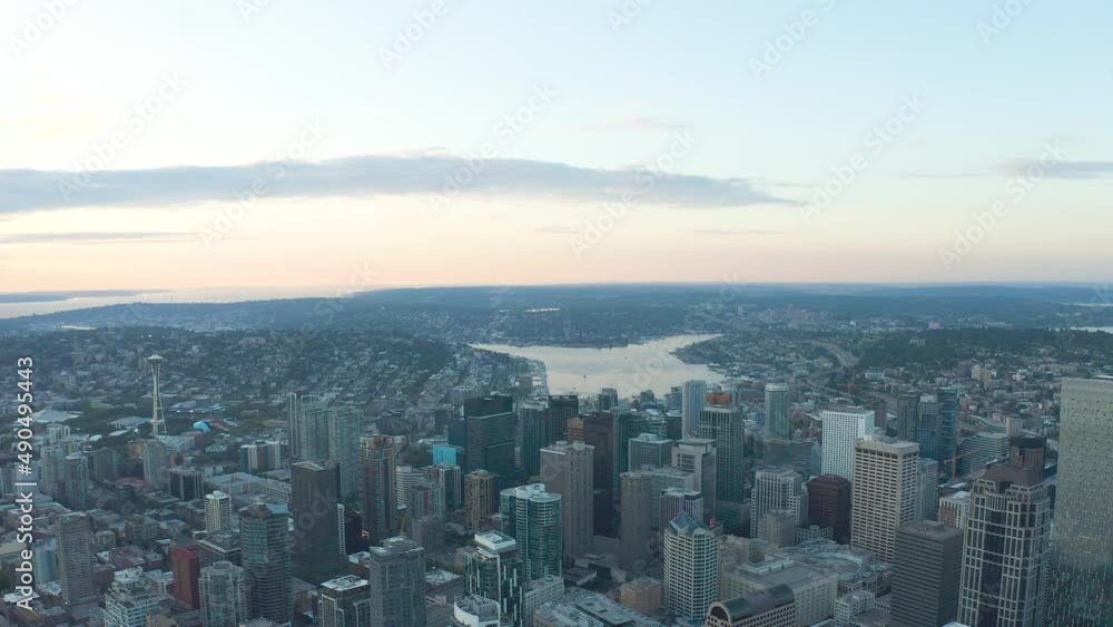 Wide aerial shot high above Seattle's downtown sector at sunset with Lake Union in the distance. Wide aerial shot high above Seattle's downtown sector at sunset with Lake Union in the distance.