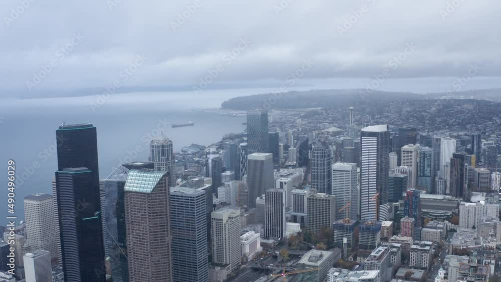 Orbiting aerial shot of Seattle's dreary downtown buildings. Orbiting aerial shot of Seattle's dreary downtown buildings.