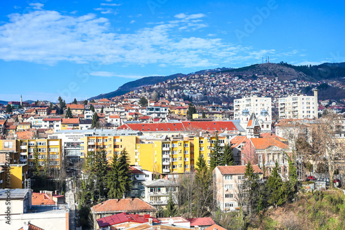 Aerial drone view of city of Sarajevo. Capital of Bosnia and Herzegovina. Roofs and buildings.