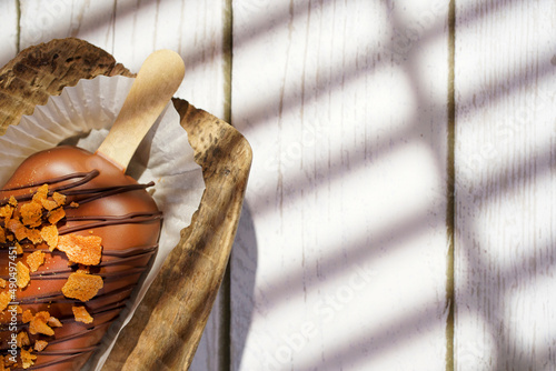 Homemade cookies with raisins, chocolate, nuts on a wooden table and a art background . Breakfast. Close up.