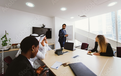 Photography Multiethnic western and middle eastern business team working together in an office of Dubai