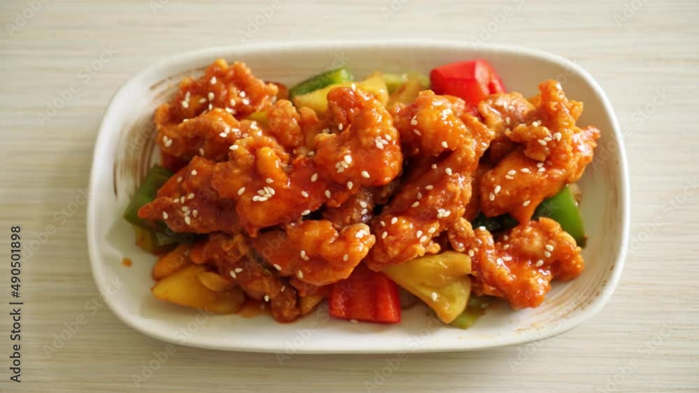 fried crispy chicken with sweet and sour sauce in Korean style fried crispy chicken with sweet and sour sauce in Korean style