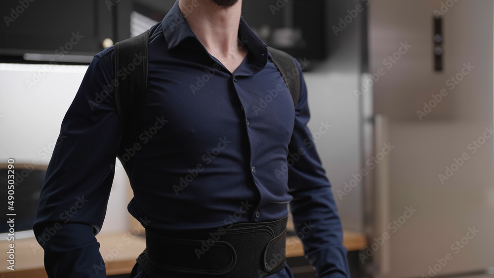 Headless male person in dark blue collar shirt wear posture belt - obrazy, fototapety, plakaty 