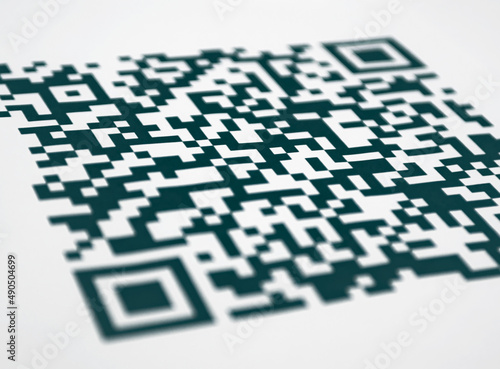 A QR code close up colored on the white background