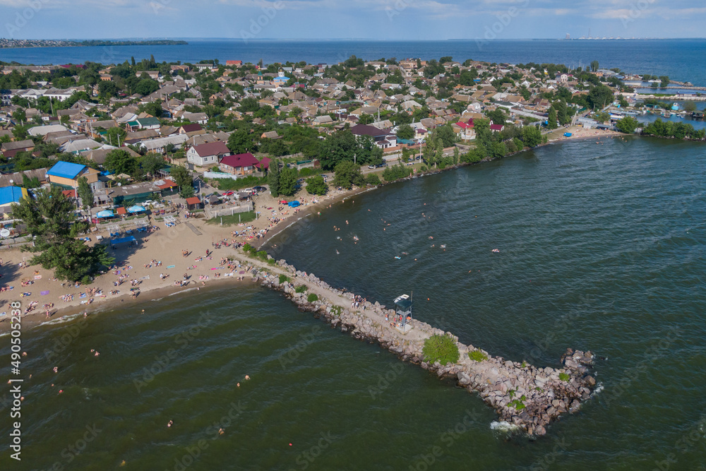 Nikopol city beach from a bird's eye view. People are resting. Lentinium solar Ukraine