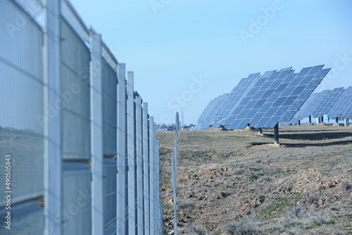 Almaty, Kazakhstan - 03.11.2016 : Solar panels of different sizes are lined up in a row to collect energy. photo