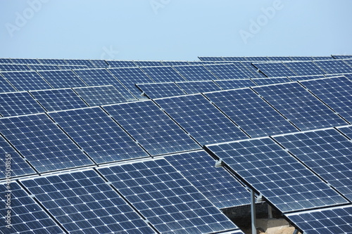 Almaty, Kazakhstan - 03.11.2016 : Solar panels of different sizes are lined up in a row to collect energy. photo