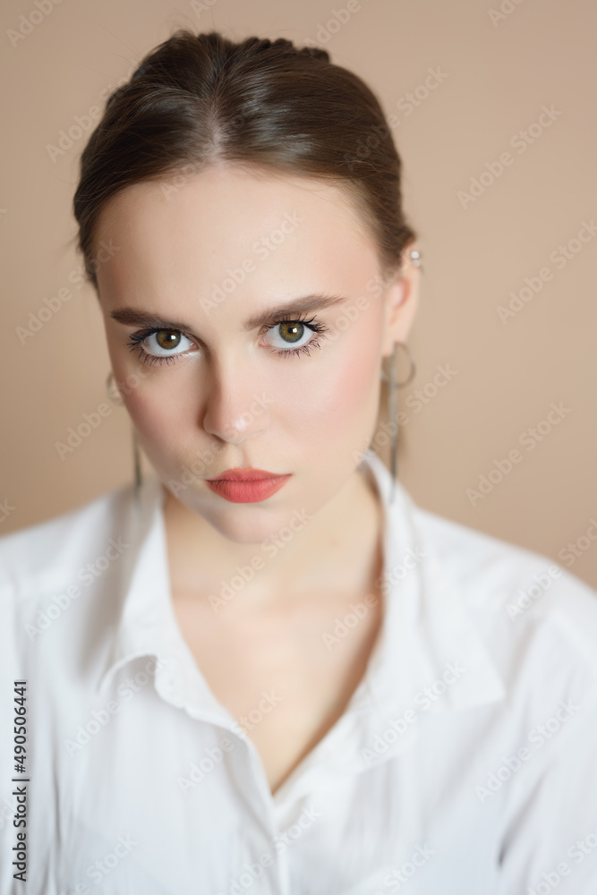 Portrait of a beautiful young woman with brown eyes. Portrait of a beautiful young woman with brown eyes.