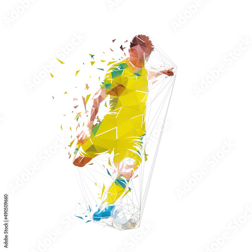 Soccer player kicking ball, low polygonal footballer shoots and scores a goal, geometric isolated vector illustration from triangles, front view