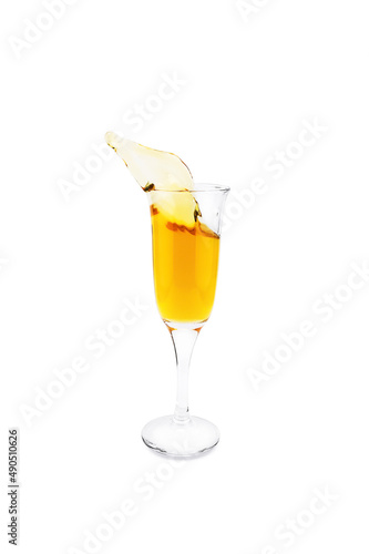 Transparent wineglass with yellow liquid splash, isolated on white background