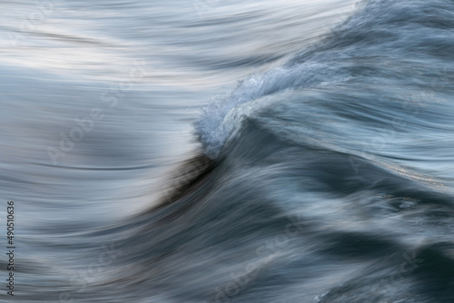 Silky texture of water wave in long exposure and motion blur - abstract landscape close up