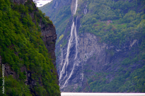 Breathtaking scenery of mountains, galciers and waterfalls in Geirangerfjord during cruising to Norway in Geiranger with beautiful scenic panorama nature landscape in Fjord photo