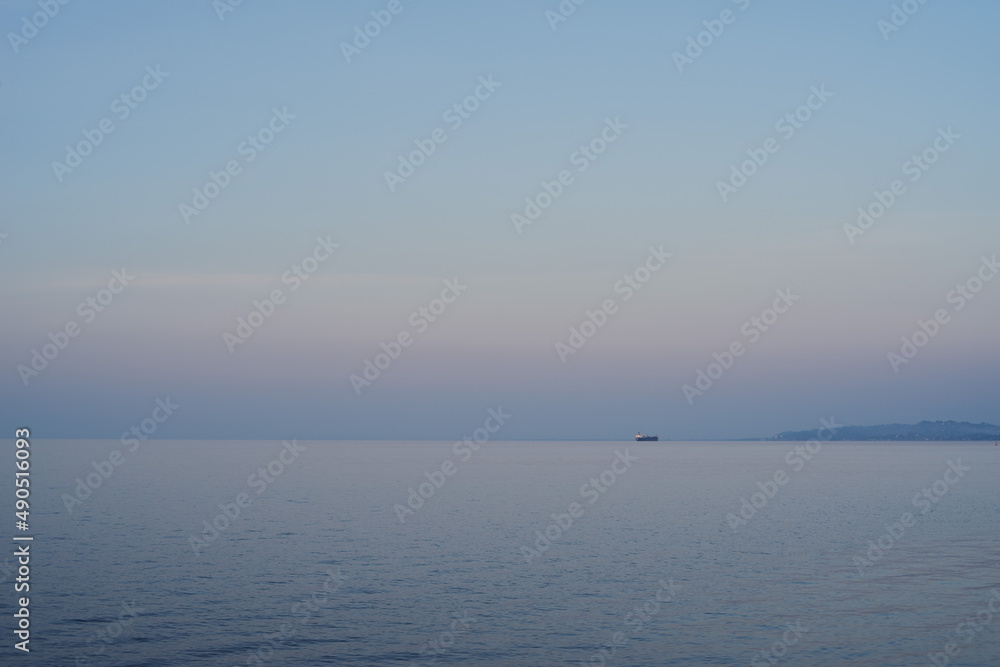 A boat in the sunset near the mountains A boat in the sunset near the mountains