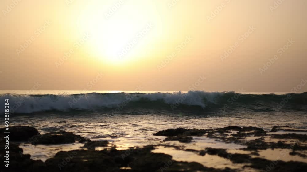 Sea waves rushing at beach during sunset
Sea waves rushing at beach during sunset