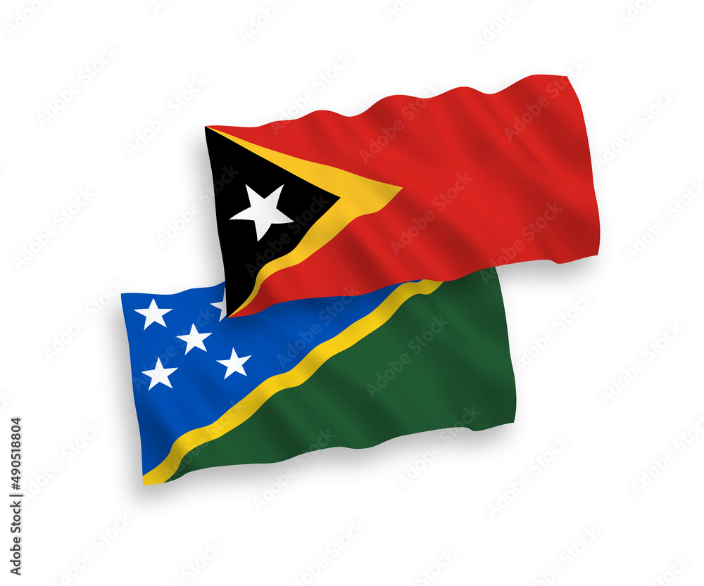 National vector fabric wave flags of Solomon Islands and East Timor isolated on white background. 1 to 2 proportion. National vector fabric wave flags of Solomon Islands and East Timor isolated on white background. 1 to 2 proportion.