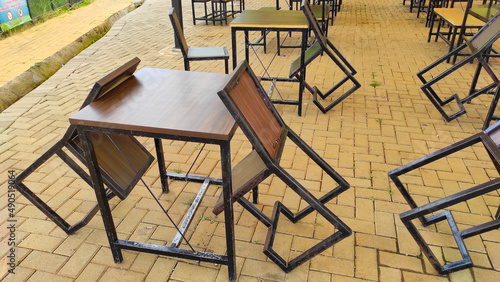 Abstract Defocused A chair leaning sideways on a table at an outdoor restaurant in the Cicalengka Tourism area, Indonesia