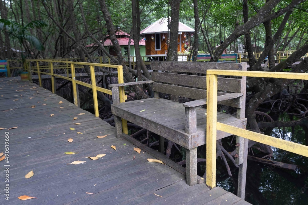 ironwood chairs for tourists resting in the mangrove forest tourism park