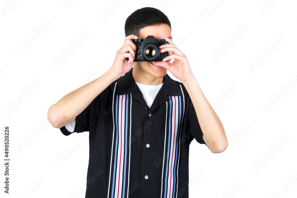 Guy using an analog camera. 35mm photographic camera. Isolated on white background. 18-20 years old latin american guy. Guy using an analog camera. 35mm photographic camera. Isolated on white background. 18-20 years old latin american guy.