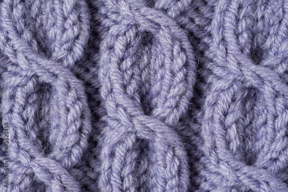 Knitted texture background. Hand-knitted wool. Macrophotography of a thread drawing. Gray-lilac texture of sweaters, pullovers, cardigans. Abstract natural background. Comfort autumn warmth concept Knitted texture background. Hand-knitted wool. Macrophotography of a thread drawing. Gray-lilac texture of sweaters, pullovers, cardigans. Abstract natural background. Comfort autumn warmth concept