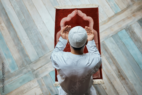 Above view of Muslim man in a prayer at mosque. photo