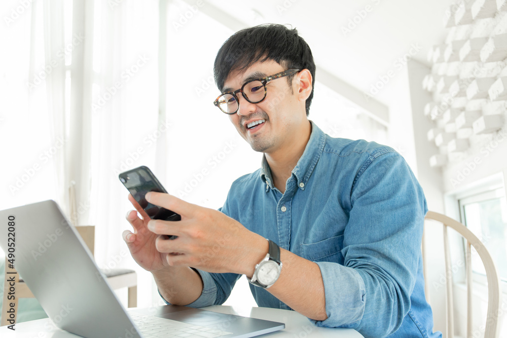 man work using typing computer texting cell phone.student study education online learning.adult professional chatting on laptop,mobile contact us at Thinking business plan.connecting people concept man work using typing computer texting cell phone.student study education online learning.adult professional chatting on laptop,mobile contact us at Thinking business plan.connecting people concept