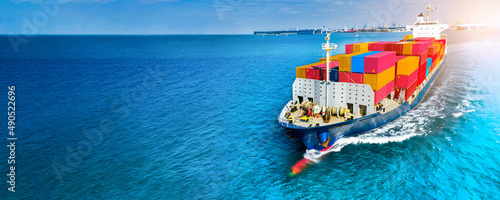 Aerial side view of cargo ship carrying container and running on blue sea for export  goods  from  cargo yard port to custom ocean concept technology transportation , customs clearance, webinar banner