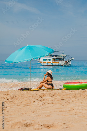 summer sea vacation concept. woman sunbathing at the beach