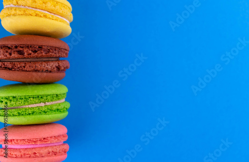 Macaroons on a blue background. Copy space. French macaroons.