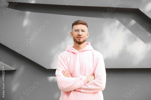 Young guy in stylish hoodie...