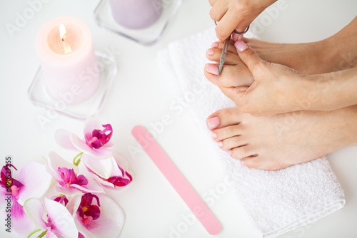 Woman Doing Pedicure Caring For Fingernails At Home
