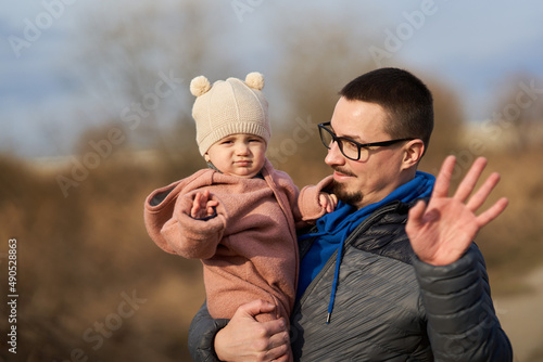Man and his little daughter outdoor in the park