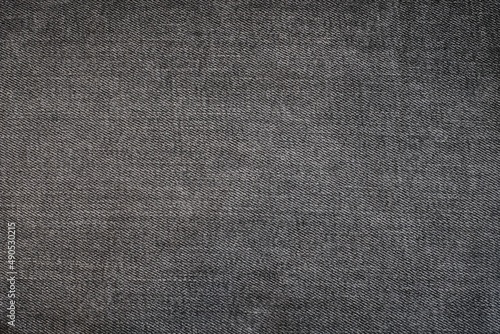 black denim jeans fabric texture, black background