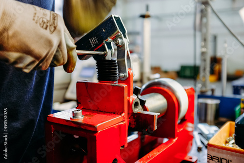 worker holding a metal plate