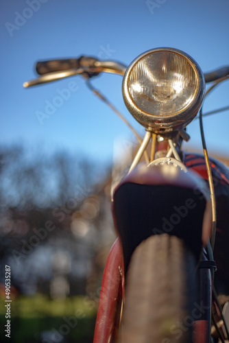 Moped in front view at sunset