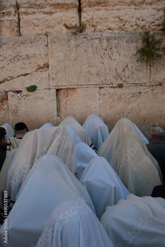 Jewish priests known as Cohanim cover their heads with prayer shawls in the prayer section beside the Western Wall in Jerusalem for the blessing for the Jewish people on Passover and Sukkot. 